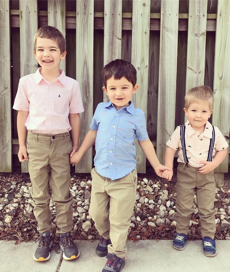 three homeschool boys holding hands