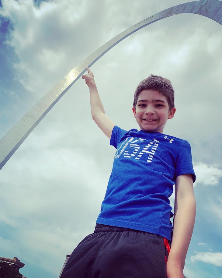 boy adventuring at the arch