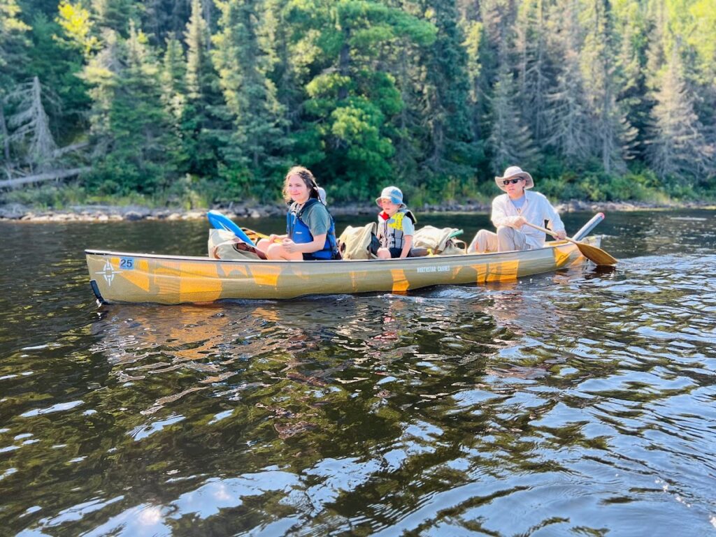 homeschool family in a canoe on the lake