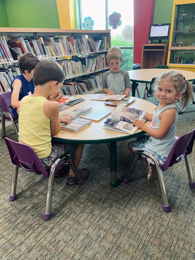 homeschool children reading at the library