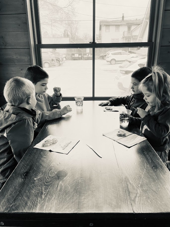 four homeschool children at coffee shop