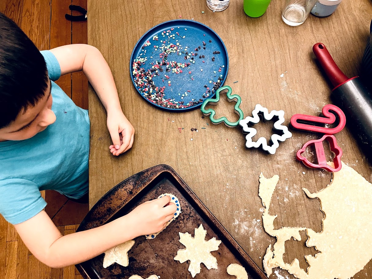 homeschool boy making cut out sugar cookies