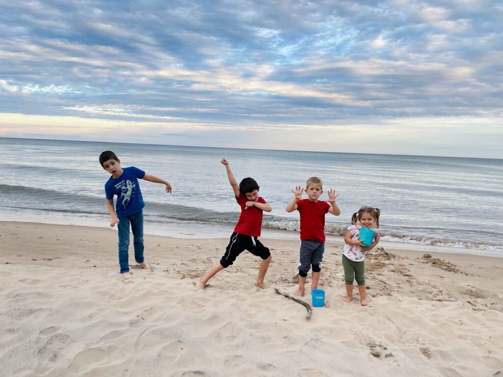 four homeschool kids at the beach