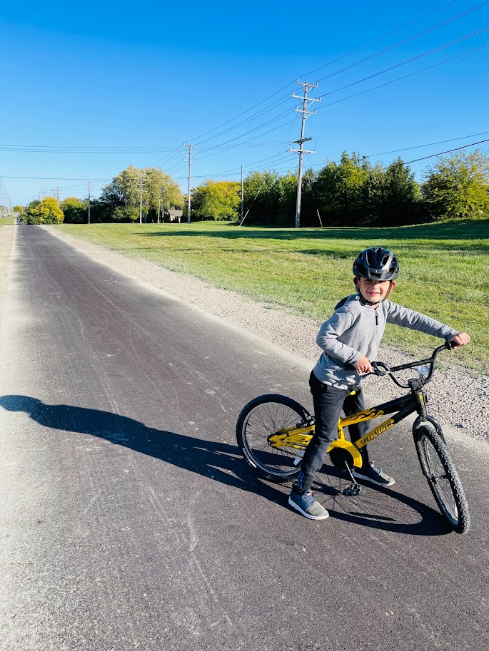 homeschool boy riding his bike