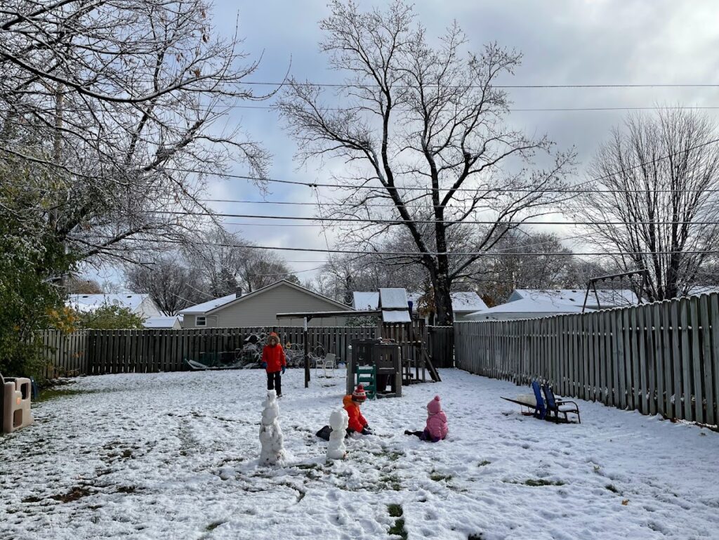 homeschool children playing in december snow