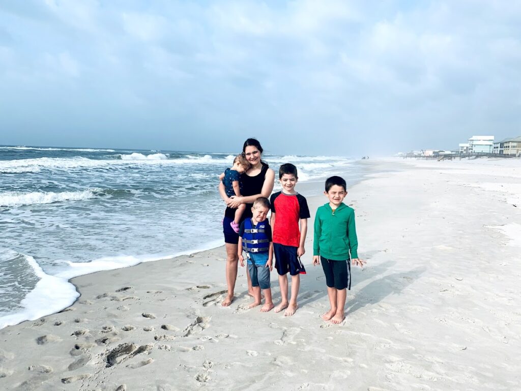 homeschooling family at the beach