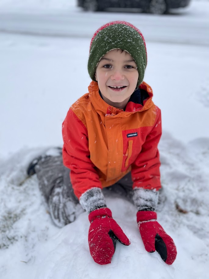 homeschool boy playing in the snow