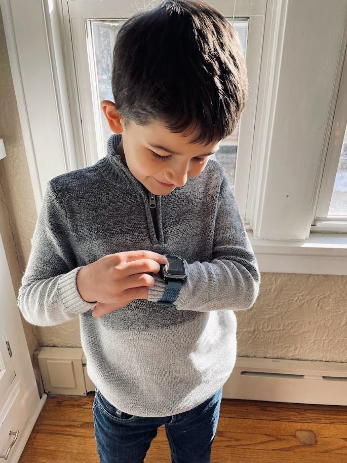 boy using smart watch in a positive way