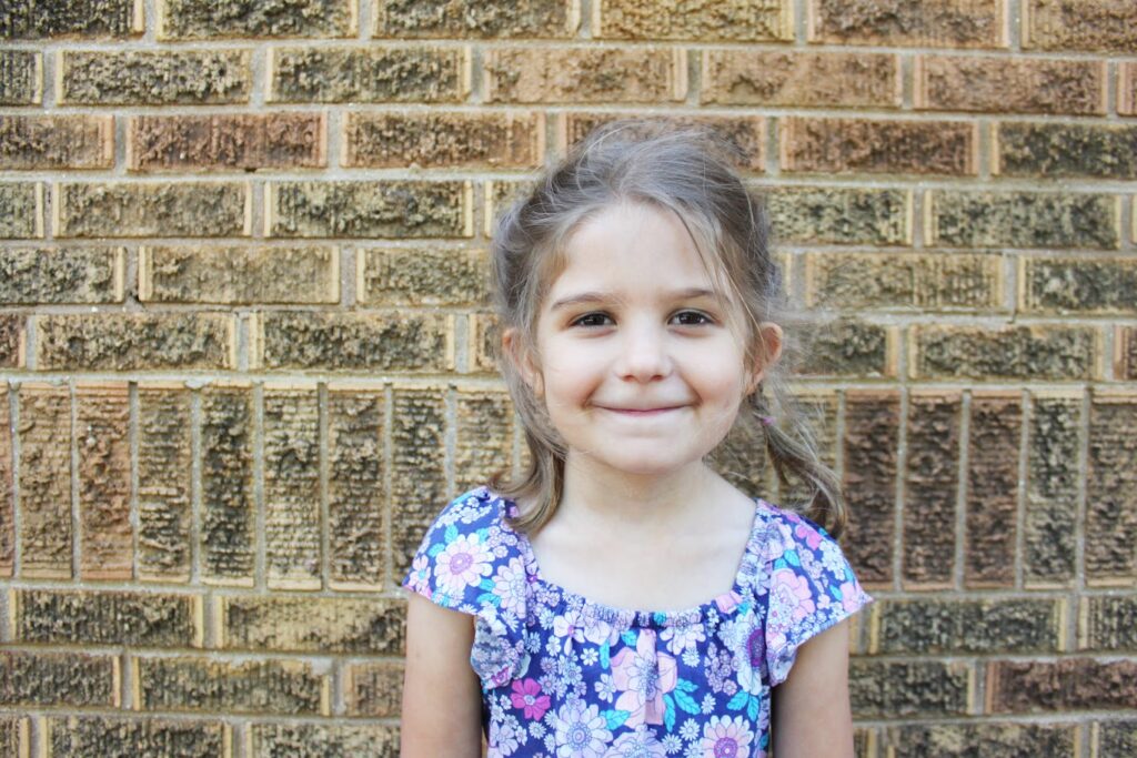 preschool girl smiling at the camera