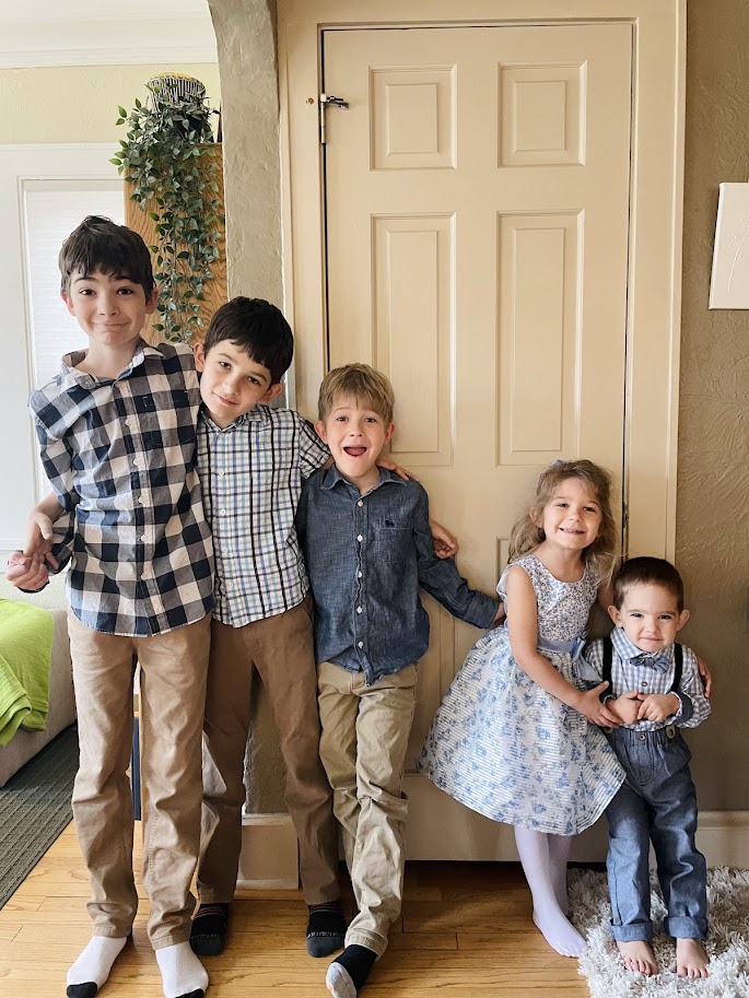 five homeschool children standing near front door