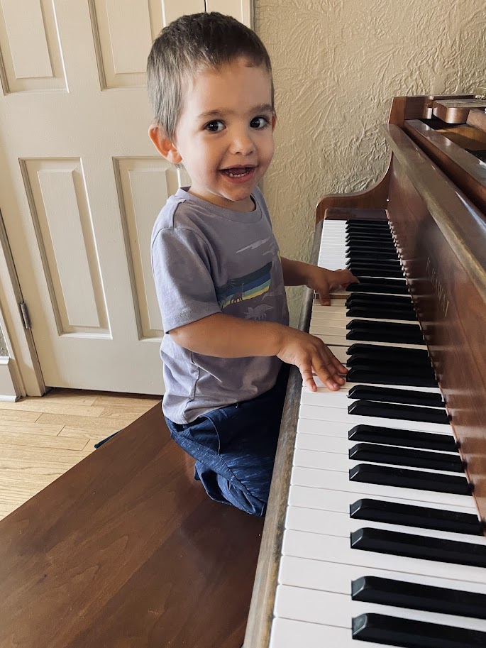 toddler homeschool boy playing the piano