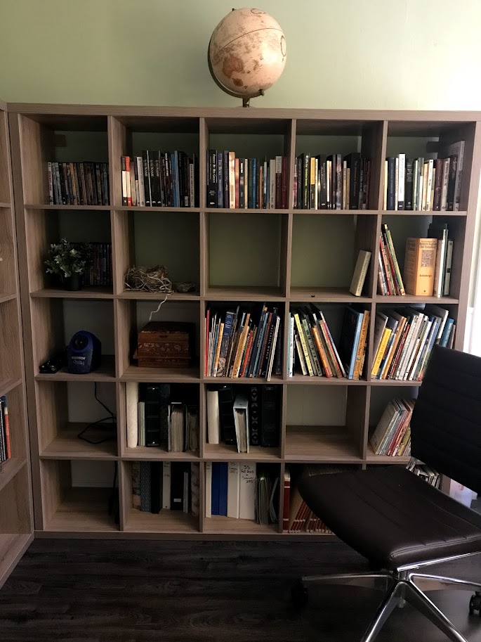 large bookshelf full of essential homeschool supplies