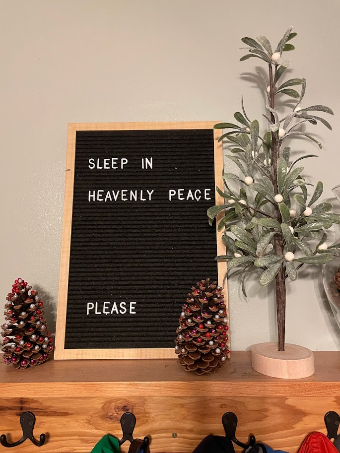 christmas decorations on a wooden shelf