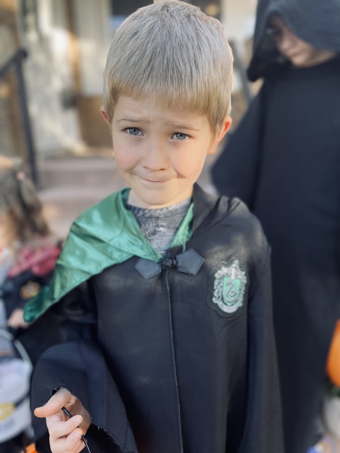 homeschool boy wearing Hogwarts robes for Halloween