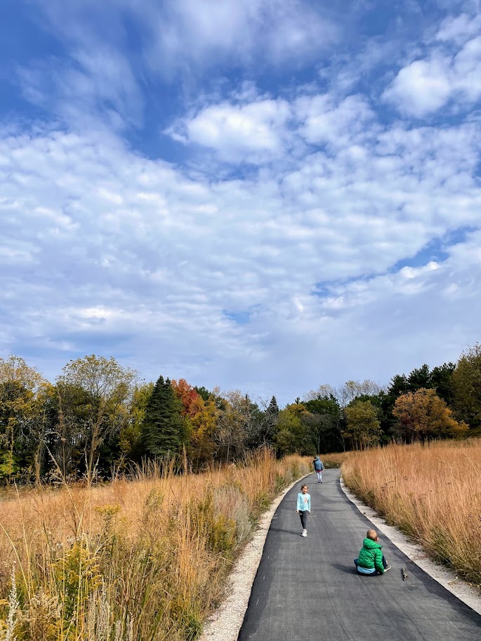 homeschool children walking outside in the autumn