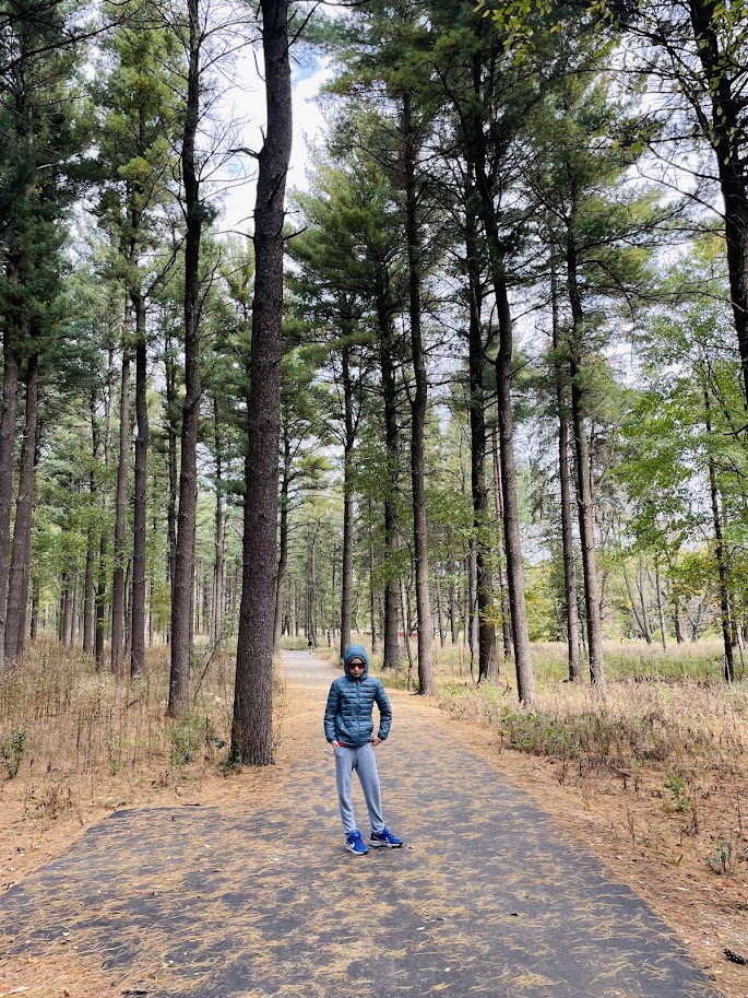 homeschool boy hiking in the woods of wisconsin