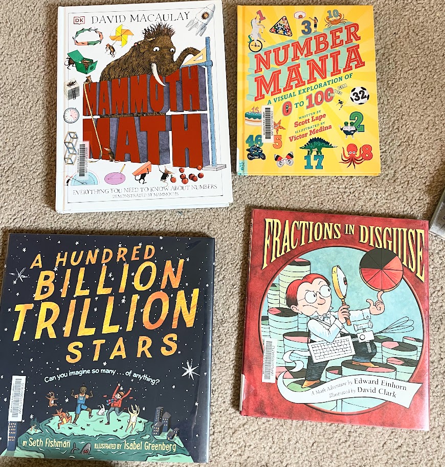 more math picture books for homeschooling lying on the floor