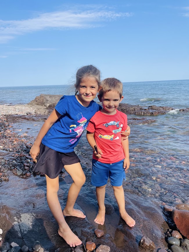homeschool girl and boy near lake superior